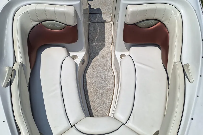 Slide: The Image of 2004 Sea Ray 240 Select boat interior with white and brown leather seating. - 15