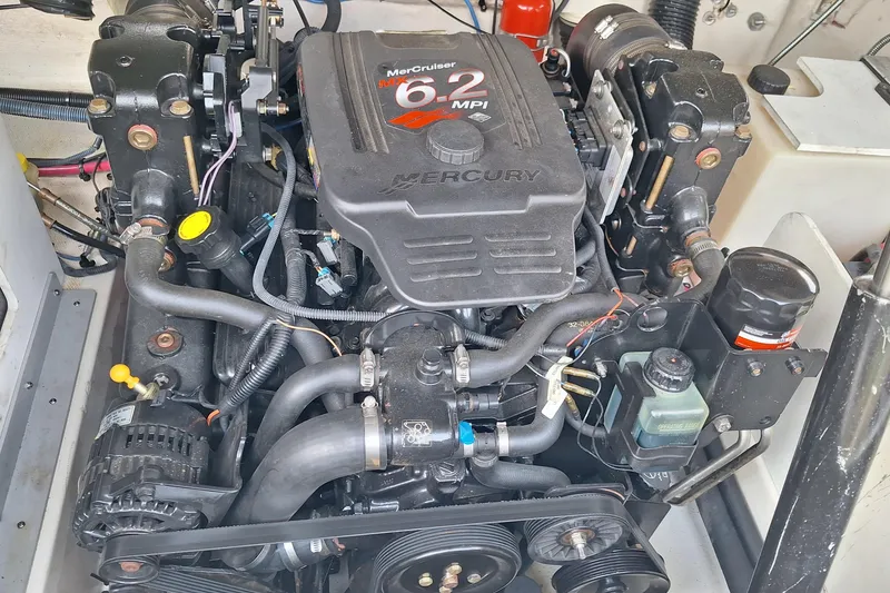 Slide: The Image of Engine of a 2004 Sea Ray 240 Select boat, featuring a MerCruiser 6.2 MPI. - 22