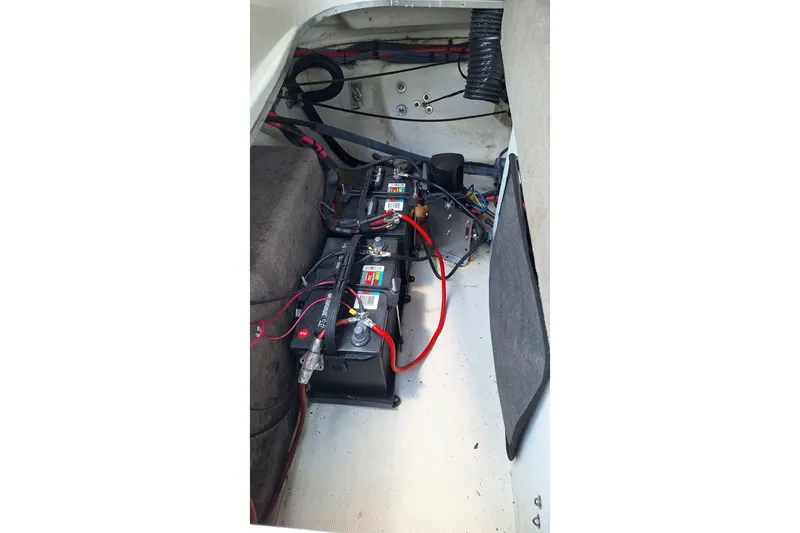 Slide: The Image of Battery compartment of a 2004 Sea Ray 240 Select boat with wiring. - 23