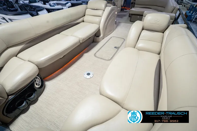 Slide: The Image of Luxurious interior of 2018 Regency 254 DL3 pontoon boat with beige seating. - 13