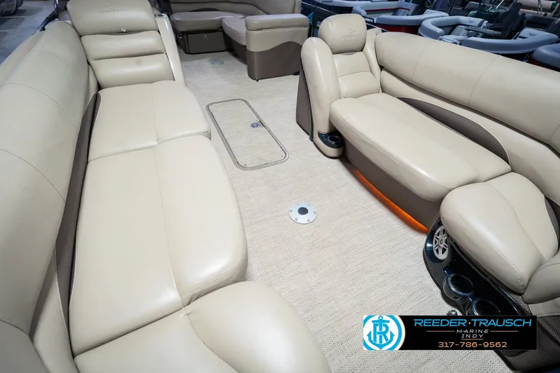 Slide: The Image of Luxurious interior of 2018 Regency 254 DL3 pontoon boat with beige seating. - 14