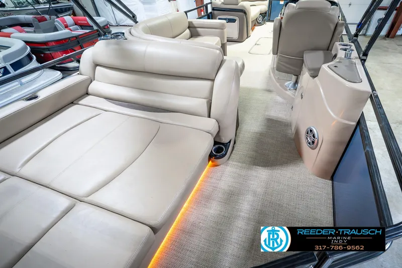 Slide: The Image of Luxurious interior of 2018 Regency 254 DL3 pontoon boat with beige seating and ambient lighting. - 16
