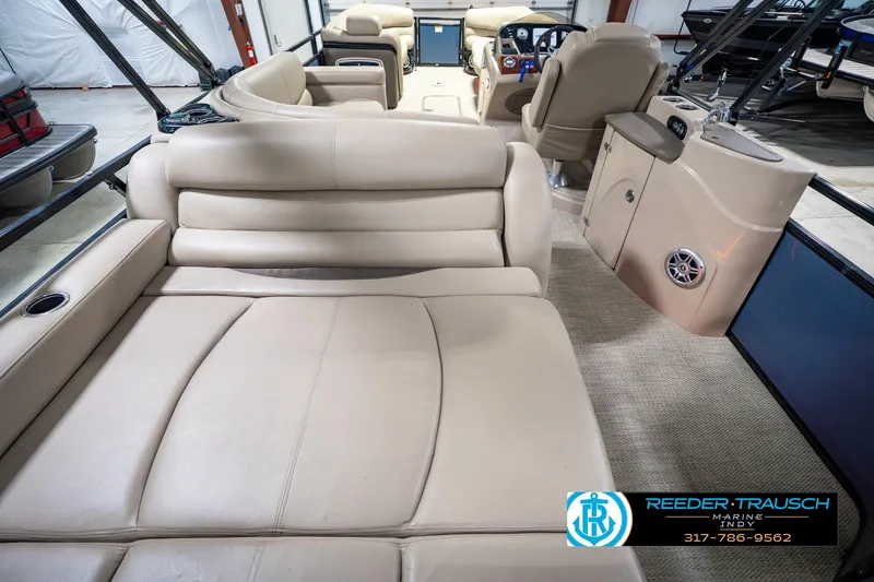 Slide: The Image of Luxurious interior of 2018 Regency 254 DL3 pontoon boat with beige seating. - 22