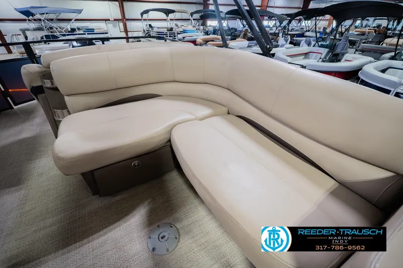 Slide: The Image of Luxurious seating on a 2018 Regency 254 DL3 pontoon boat, showcased indoors. - 30