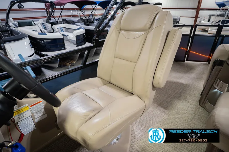 Slide: The Image of Luxurious beige captain's chair in 2018 Regency 254 DL3 boat interior. - 33