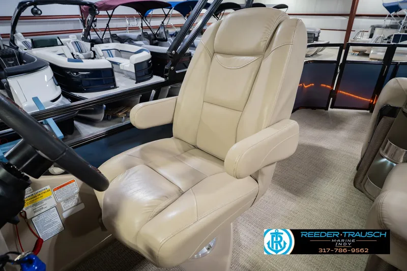 Slide: The Image of Luxurious captain's chair on 2018 Regency 254 DL3 pontoon boat, showcasing premium seating. - 34