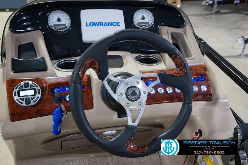 Slide: The Image of Steering wheel and dashboard of 2018 Regency 254 DL3 boat with Lowrance display. - 38