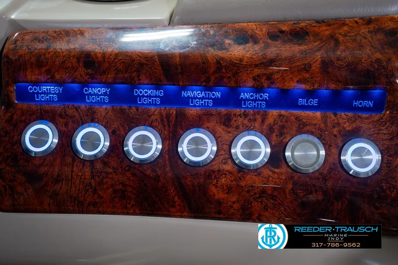 Slide: The Image of Control panel of a 2018 Regency 254 DL3 boat with illuminated switches. - 45