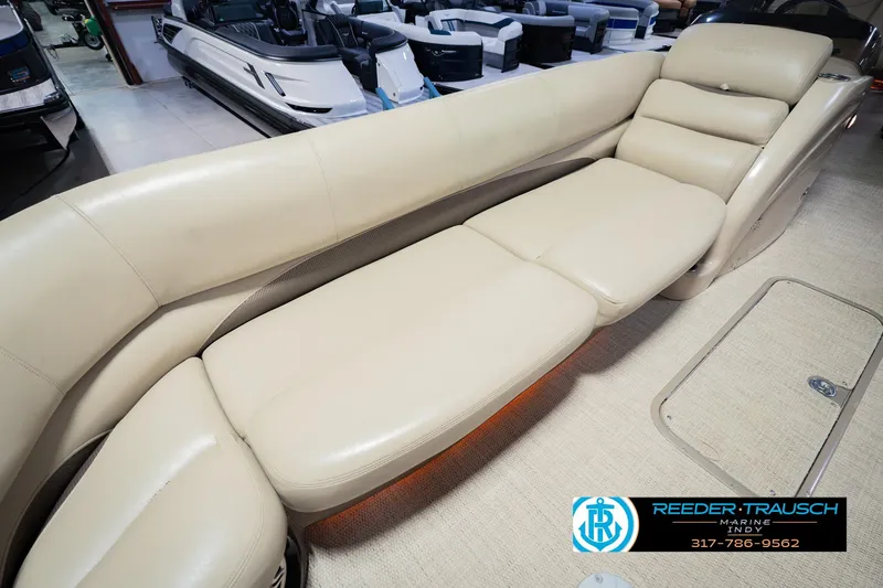 Slide: The Image of Luxurious beige seating on 2018 Regency 254 DL3 pontoon boat, showroom display. - 50