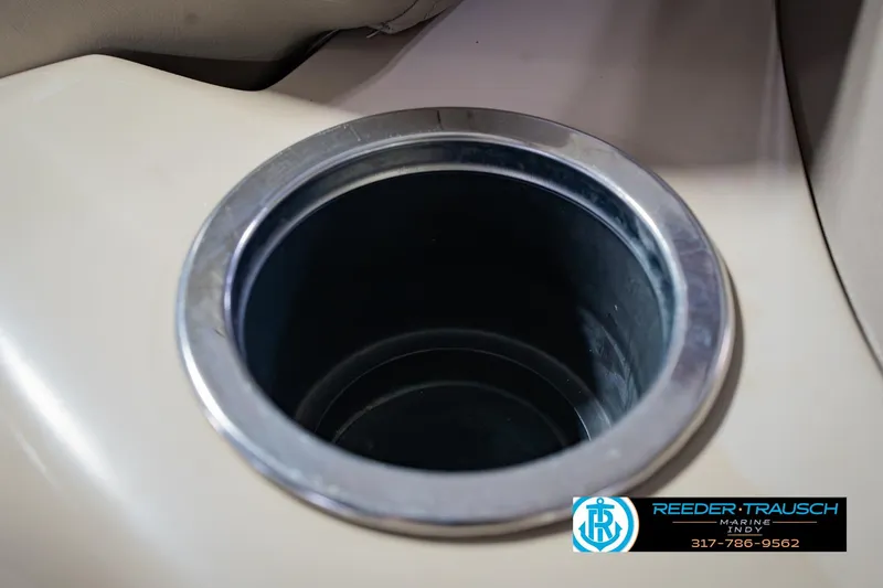 Slide: The Image of Cup holder in 2018 Regency 254 DL3 boat interior, featuring Reeder-Trausch Marine logo. - 52