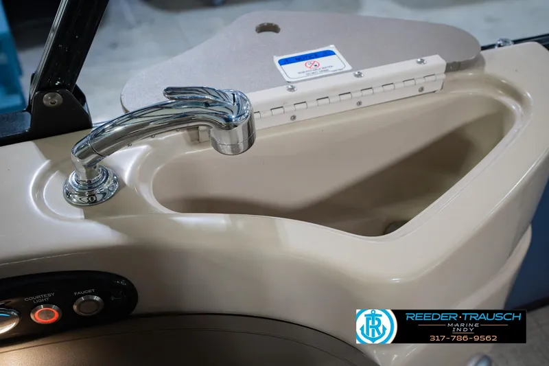 Slide: The Image of 2018 Regency 254 DL3 boat sink with chrome faucet and control panel. - 54