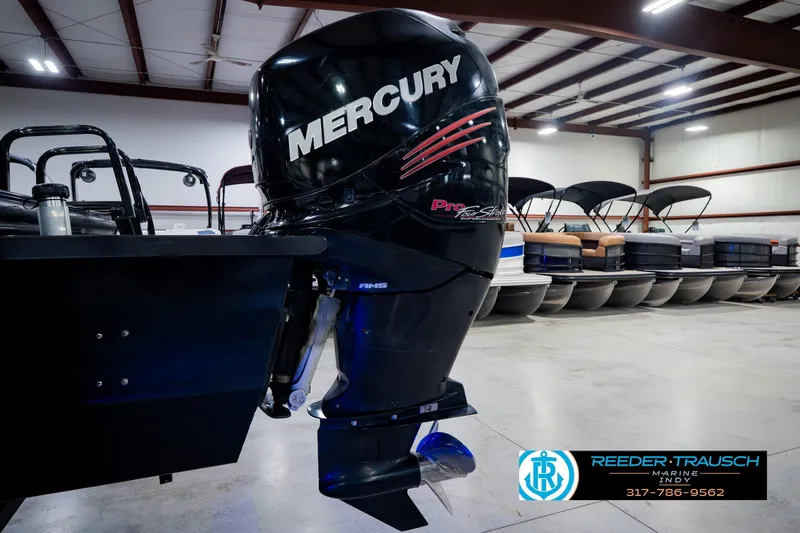 Slide: The Image of 2018 Regency 254 DL3 with Mercury outboard motor in showroom. - 56