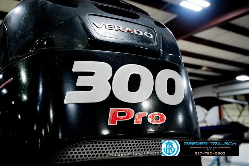 Slide: The Image of Outboard motor with "300 Pro" label on a 2018 Regency 254 DL3 boat. - 59