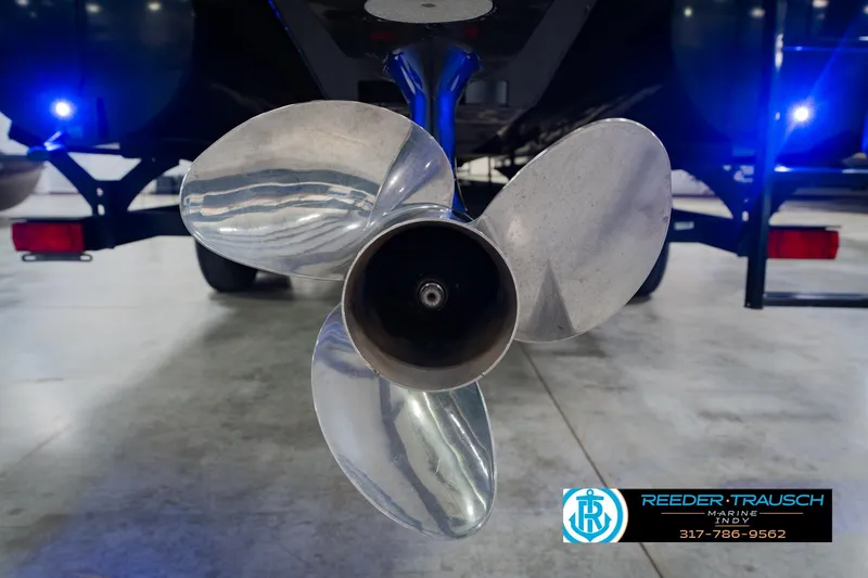 Slide: The Image of Close-up of a 2018 Regency 254 DL3 boat propeller in a showroom setting. - 60