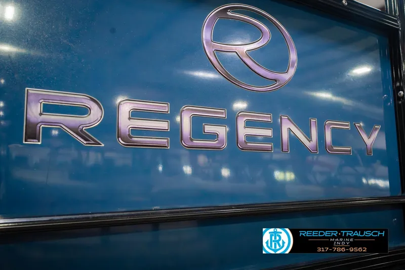 Slide: The Image of 2018 Regency 254 DL3 boat logo with dealership contact information. - 63