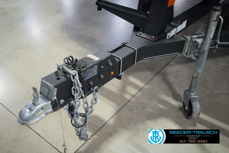Slide: The Image of Trailer hitch of a 2018 Regency 254 DL3 with safety chains and jack wheel. - 64