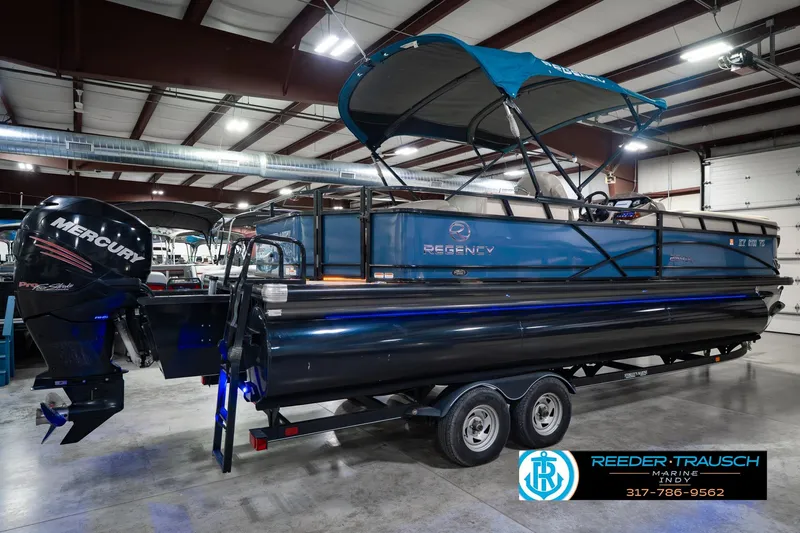 Slide: The Image of 2018 Regency 254 DL3 pontoon boat with Mercury engine in indoor showroom. - 8