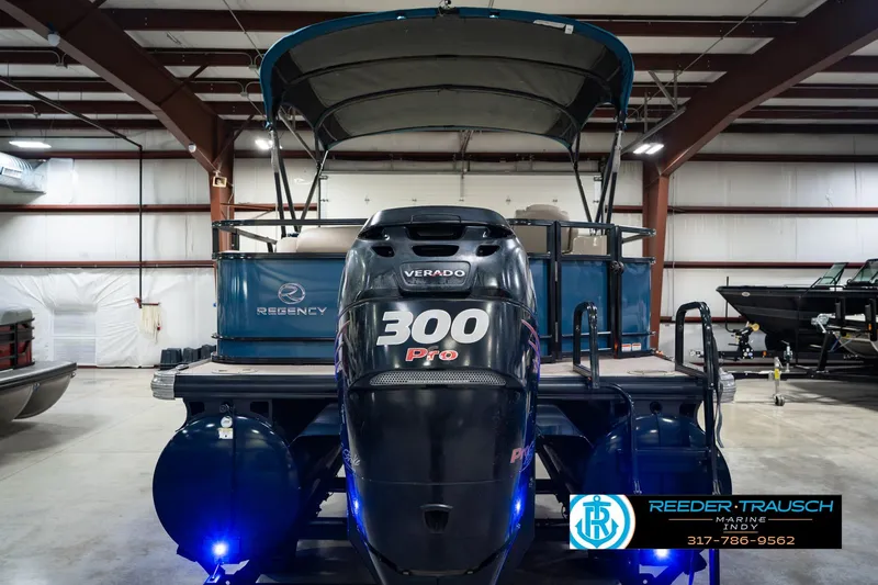 Slide: The Image of 2018 Regency 254 DL3 pontoon boat with 300 Pro motor in indoor showroom. - 9