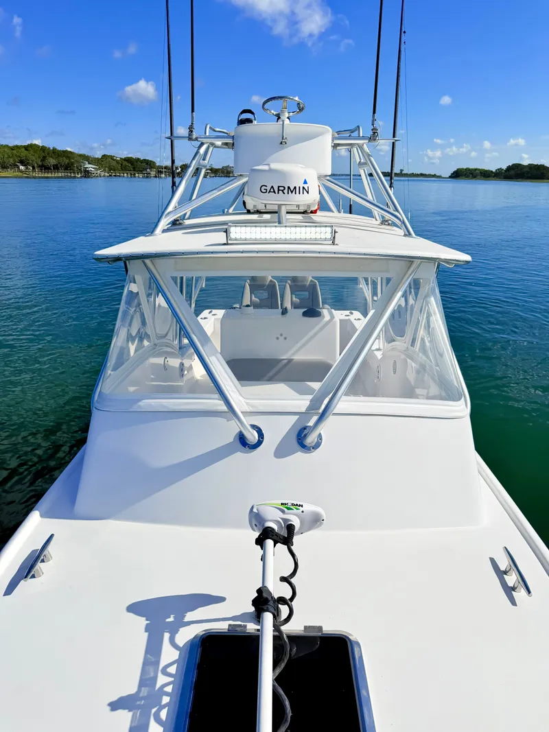 Slide: The Image of Custom Carolina 27 National boat from 1973 on calm water. - 12