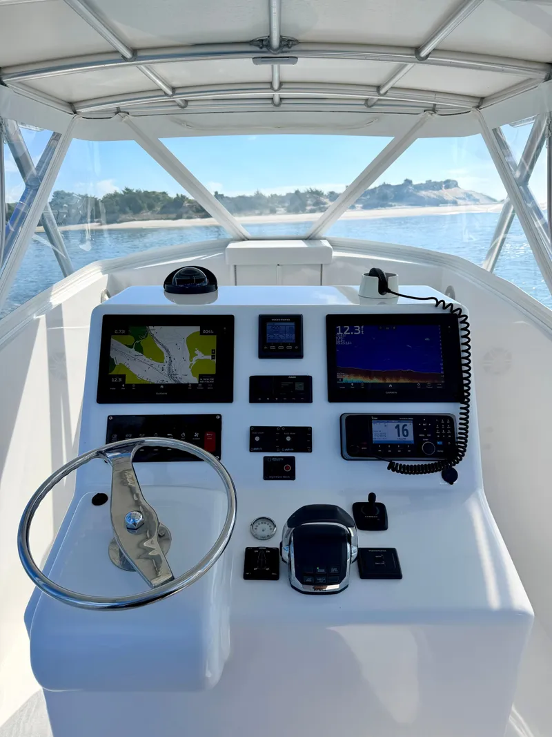 Slide: The Image of Helm of a 1973 Custom Carolina 27 National boat. - 18