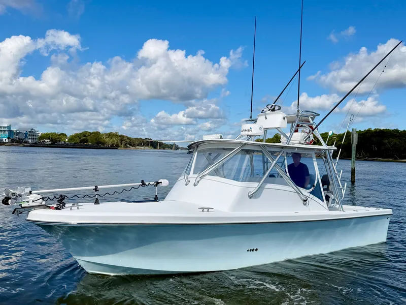Slide: The Image of Custom Carolina 27 National boat from 1973 on calm waters. - 2