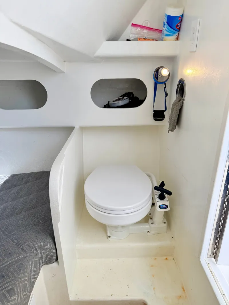 Slide: The Image of Interior of a 1973 Custom Carolina 27 National with toilet. - 28