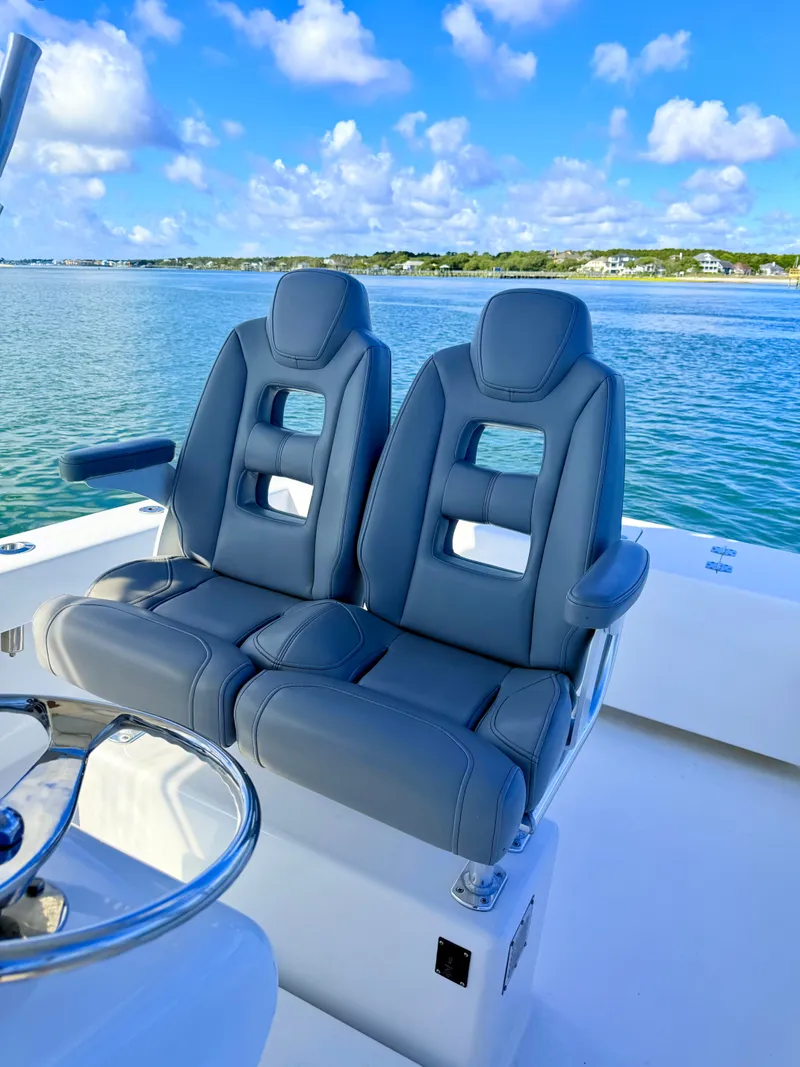 Slide: The Image of Two seats on a 1973 Custom Carolina 27 National boat. - 38