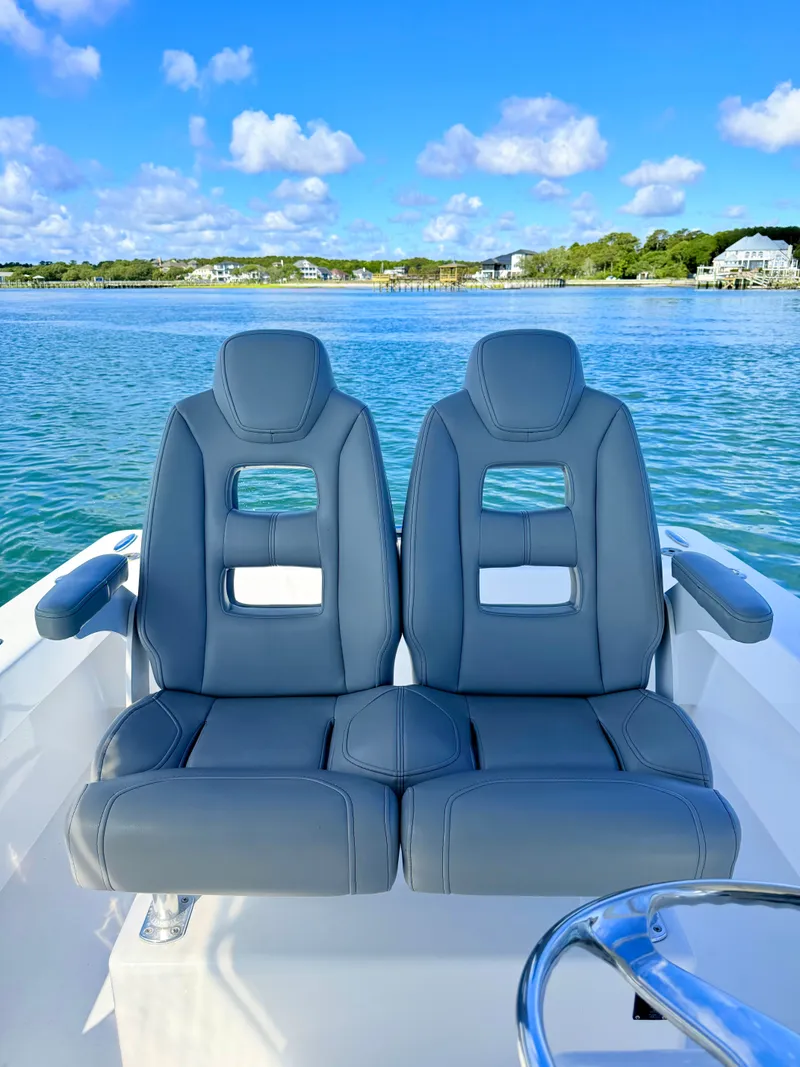 Slide: The Image of Two gray boat seats on a 1973 Custom Carolina 27 National. - 39