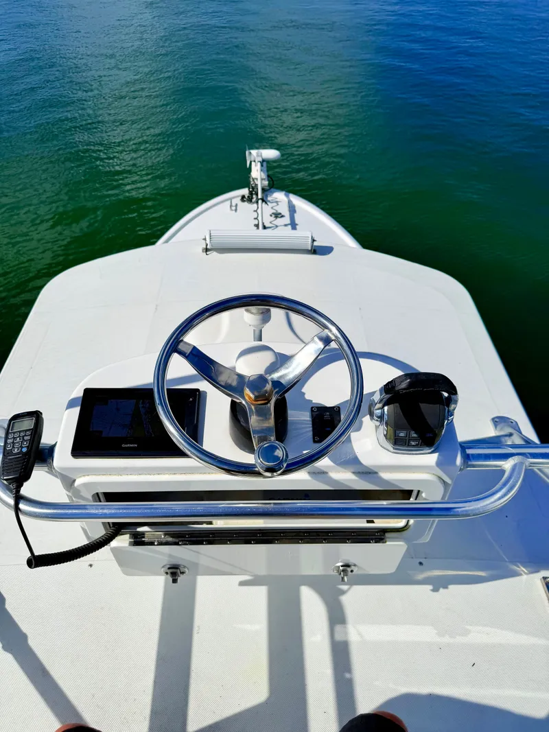 Slide: The Image of Helm of a 1973 Custom Carolina 27 National boat. - 43