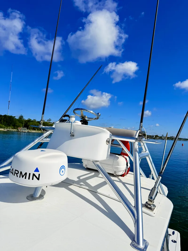 Slide: The Image of Custom Carolina 27 National 1973 boat with Garmin equipment, blue sky. - 47