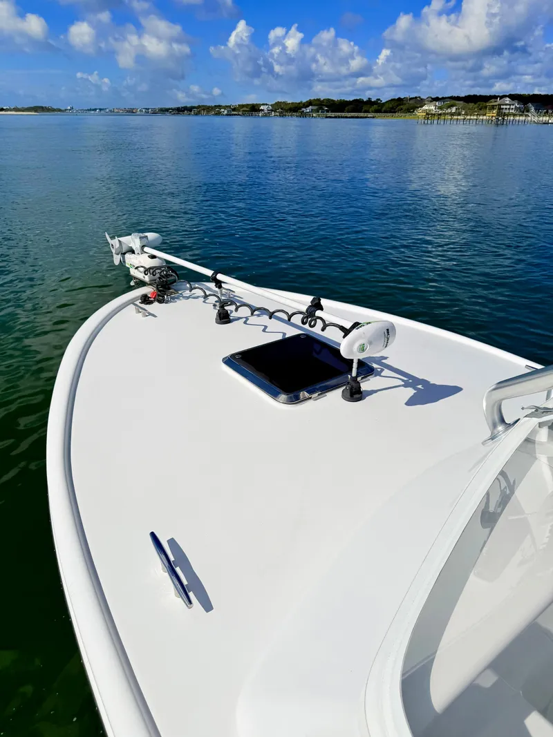 Slide: The Image of Custom Carolina 27 National boat on calm water, built in 1973. - 8