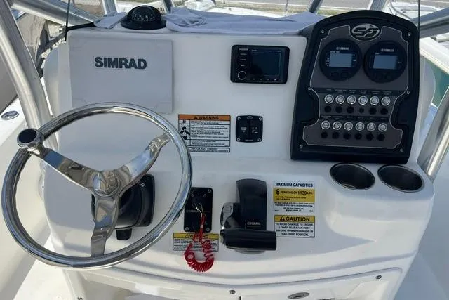 Slide: The Image of 2021 Sea Fox 220 Viper boat dashboard with steering wheel and Simrad electronics. - 7