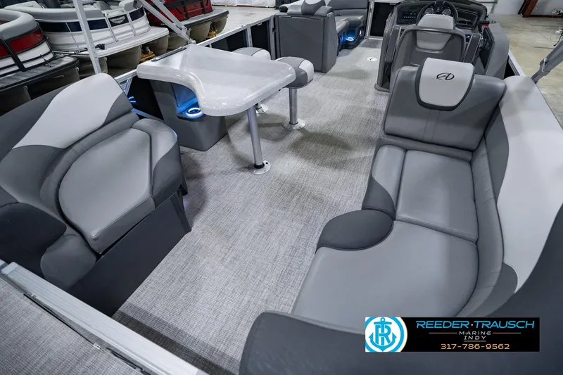 Slide: The Image of Luxurious interior of 2025 Avalon 2385 LSZ ENT pontoon boat with plush seating and table. - 16