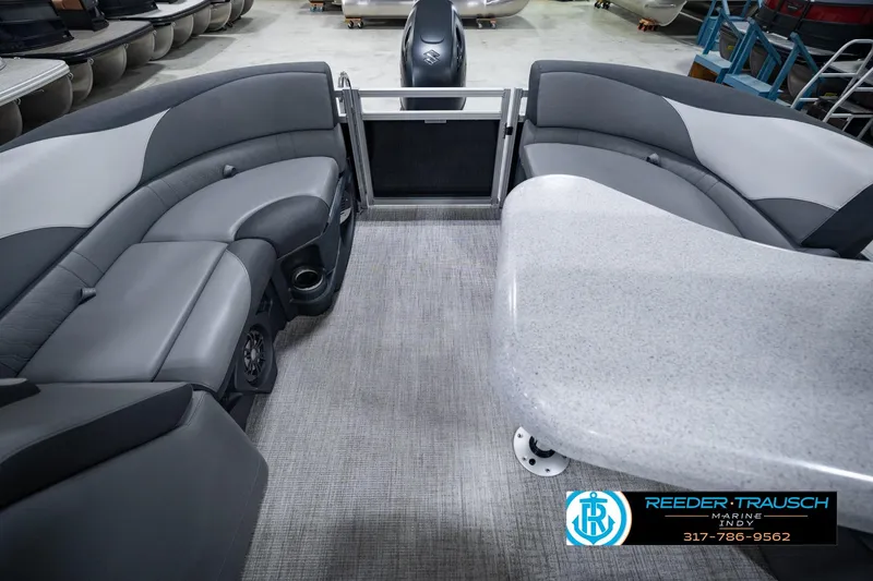 Slide: The Image of 2025 Avalon 2385 LSZ ENT pontoon boat interior with gray seating and table. - 21