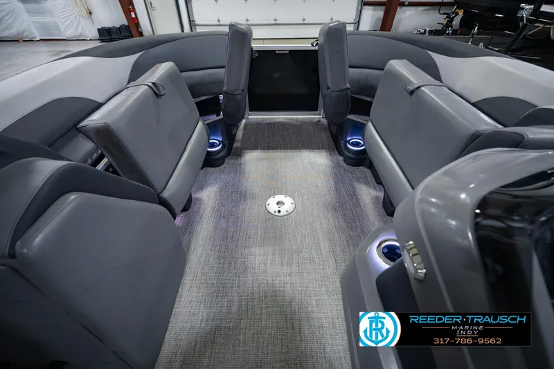 Slide: The Image of Interior of 2025 Avalon 2385 LSZ ENT boat with gray seating and ambient lighting. - 26