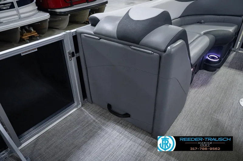 Slide: The Image of 2025 Avalon 2385 LSZ ENT pontoon boat interior with gray seating and ambient lighting. - 28