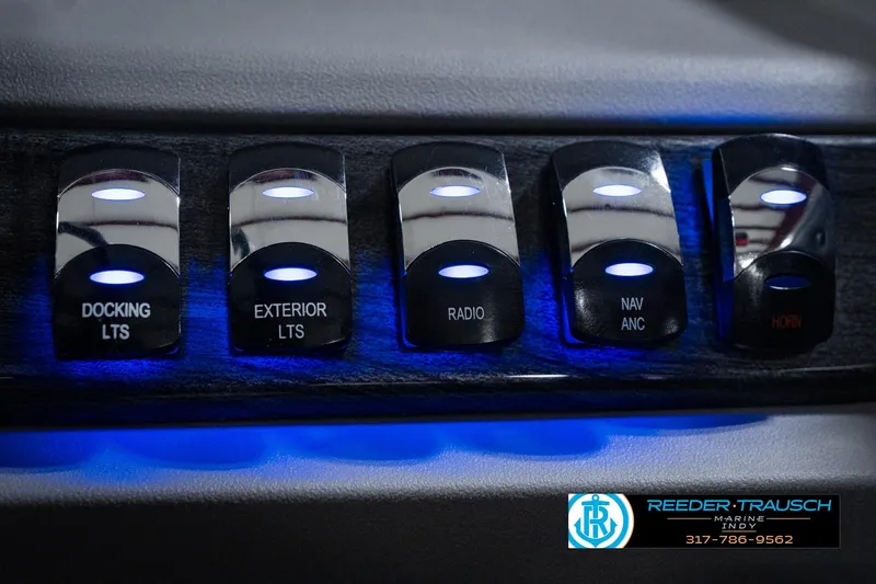 Slide: The Image of Control panel of 2025 Avalon 2385 LSZ ENT with illuminated switches for docking, exterior lights, and more. - 40