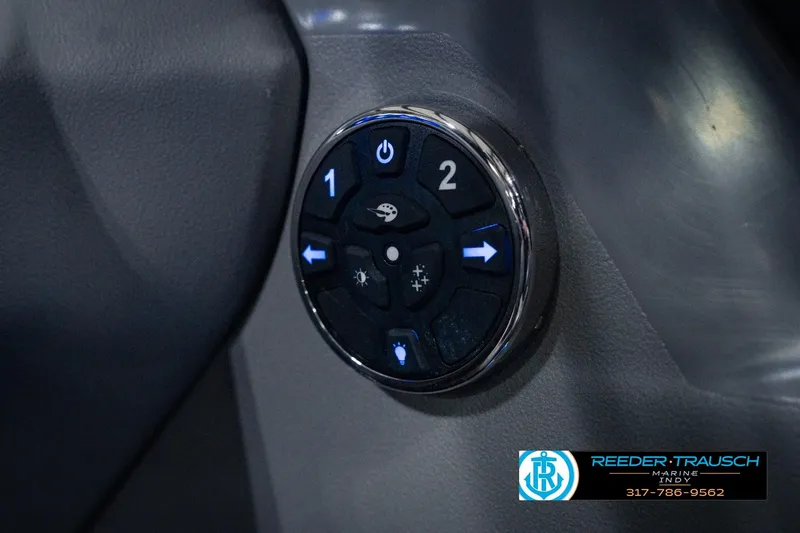 Slide: The Image of Control panel of 2025 Avalon 2385 LSZ ENT boat with illuminated buttons. - 41