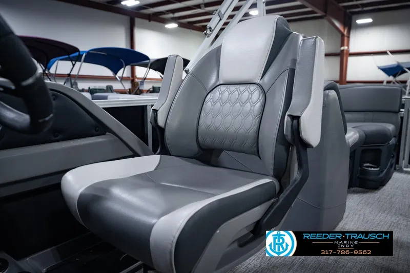 Slide: The Image of 2025 Avalon 2385 LSZ ENT boat seat with modern design in showroom setting. - 43