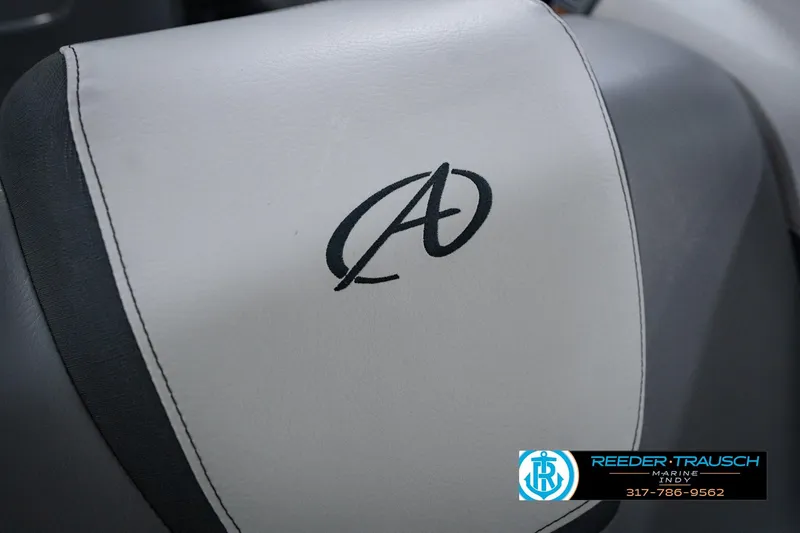 Slide: The Image of 2025 Avalon 2385 LSZ ENT boat seat with logo, Reeder-Trausch Marine contact details. - 44