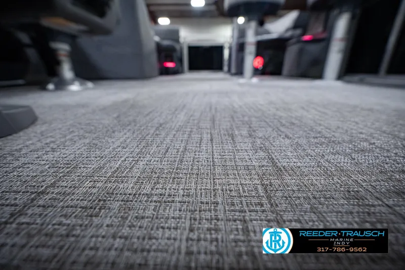 Slide: The Image of Carpeted interior of 2025 Avalon 2385 LSZ ENT boat, showcasing textured flooring. - 51