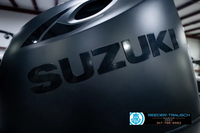 Slide: The Image of Close-up of Suzuki engine on 2025 Avalon 2385 LSZ ENT boat. - 53