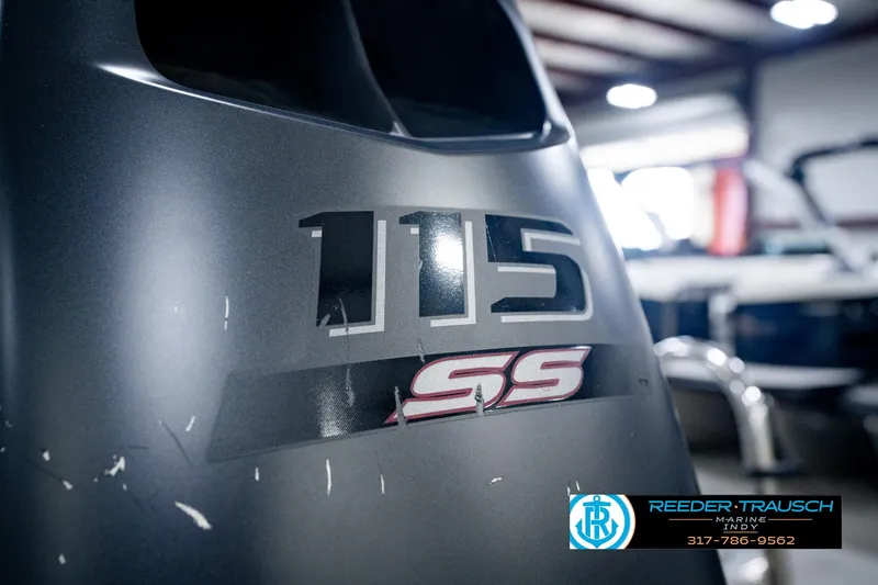 Slide: The Image of Close-up of a 2025 Avalon 2385 LSZ ENT boat engine with "115 SS" label. - 54