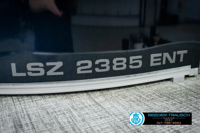 Slide: The Image of Close-up of Avalon 2025 LSZ 2385 ENT model nameplate on boat. - 57