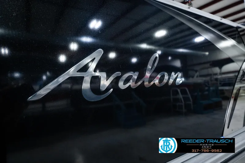 Slide: The Image of 2025 Avalon 2385 LSZ ENT boat logo in a showroom setting. - 58
