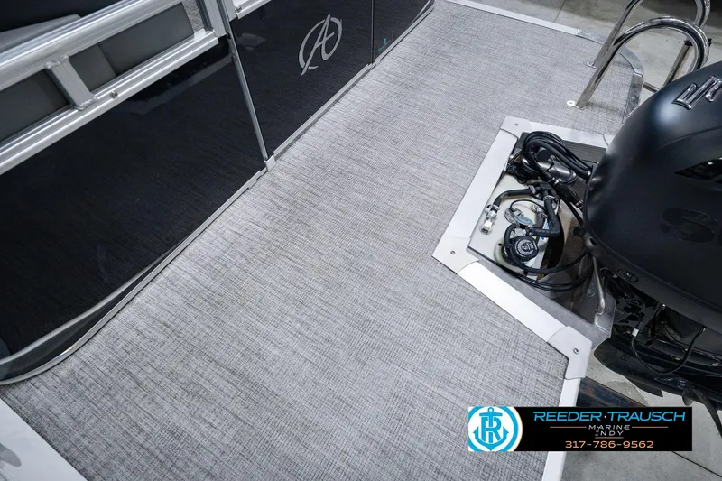 Slide: The Image of 2025 Avalon 2385 LSZ ENT boat deck with motor, featuring sleek design and modern flooring. - 59