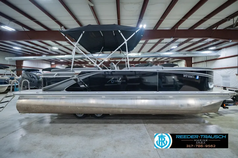 Slide: The Image of 2025 Avalon 2385 LSZ ENT pontoon boat in indoor showroom setting. - 6