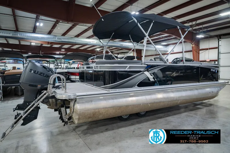 Slide: The Image of 2025 Avalon 2385 LSZ ENT pontoon boat in showroom with Suzuki outboard motor. - 8