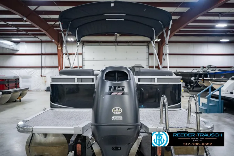 Slide: The Image of 2025 Avalon 2385 LSZ ENT pontoon boat in showroom with outboard motor. - 9