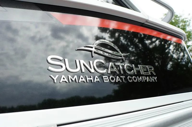 Slide: The Image of SunCatcher Yamaha Boat Company logo on 2026 Select 322SL model. - 10